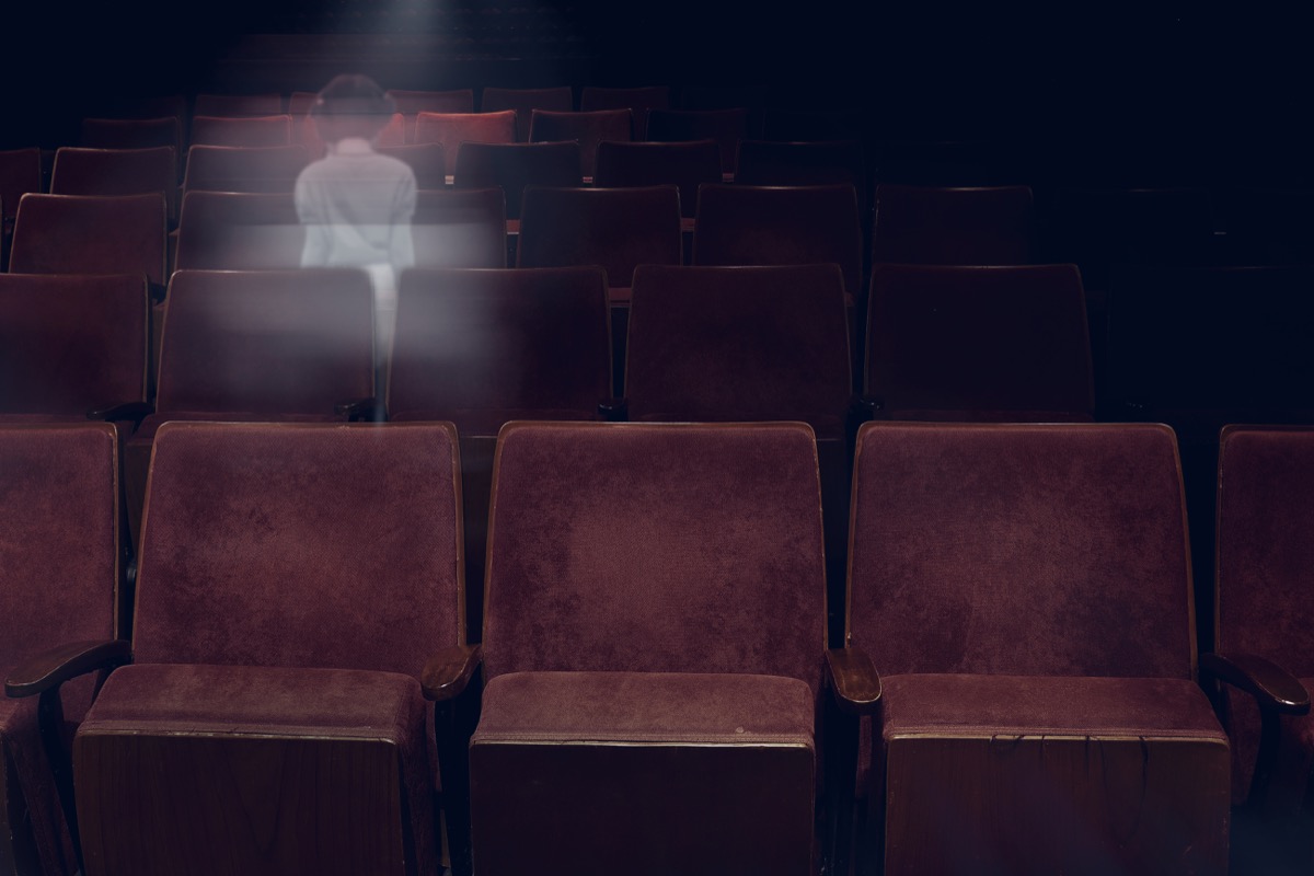 ghost of a woman in an auditorium