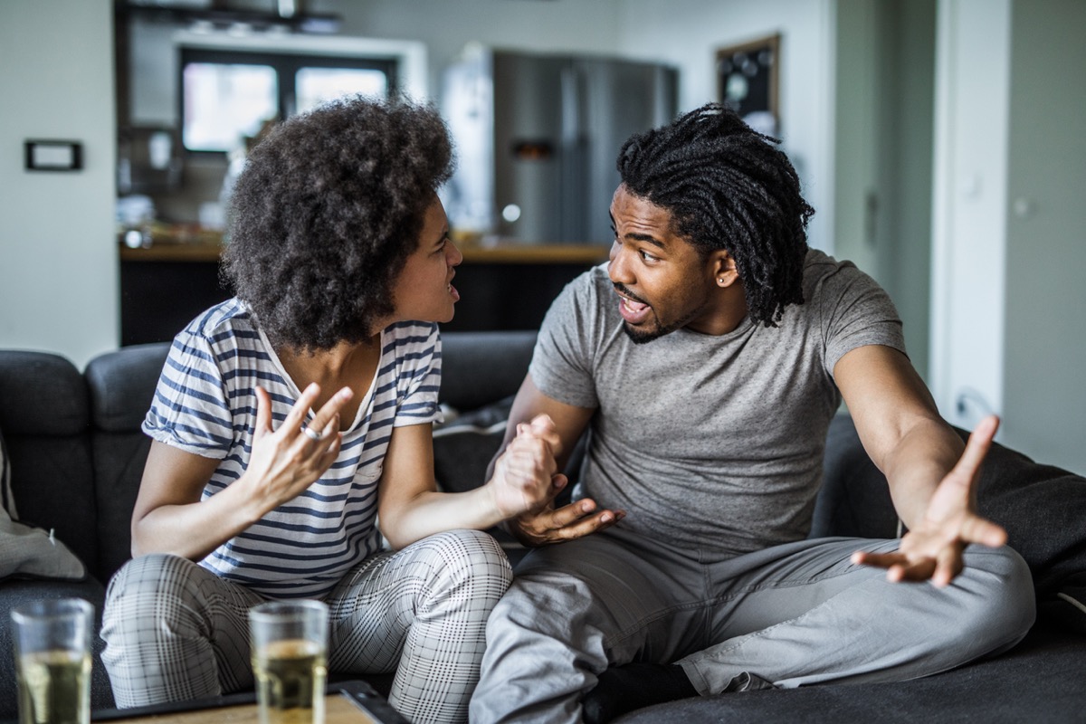 iStock. young black woman and young black man arguing with each other on th...