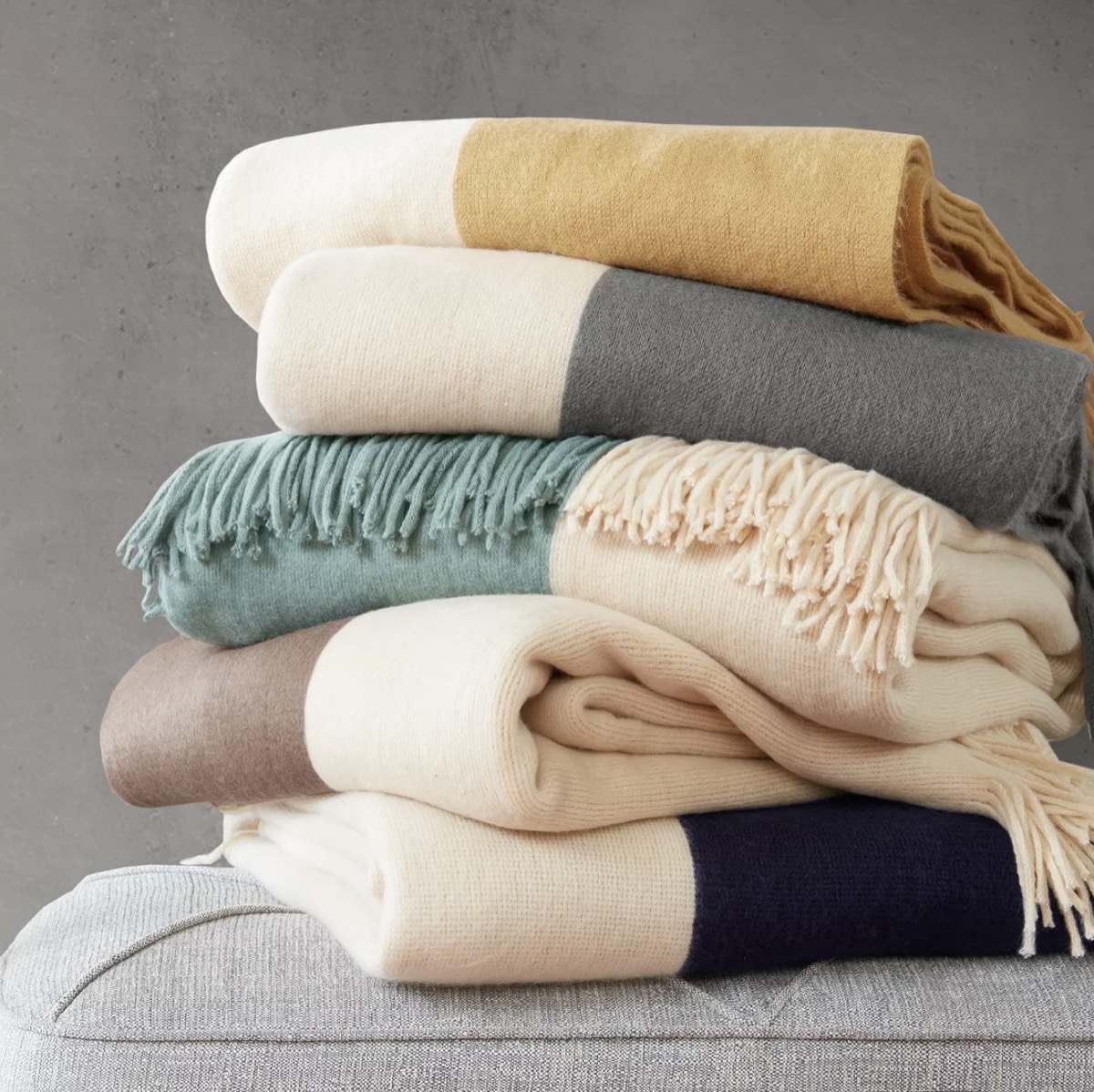 stack of color blocked throw blankets, target home decor items