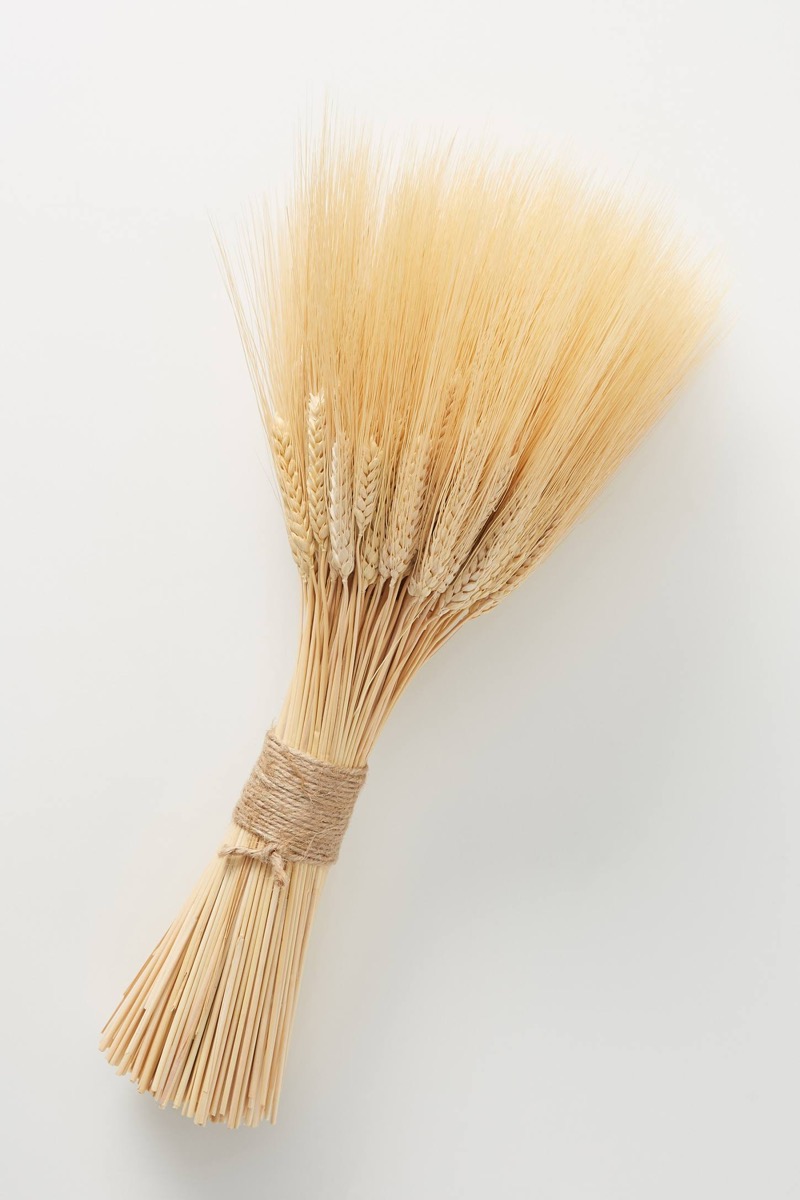 a bundle of wheat tied together with burlap cord, fall home decor