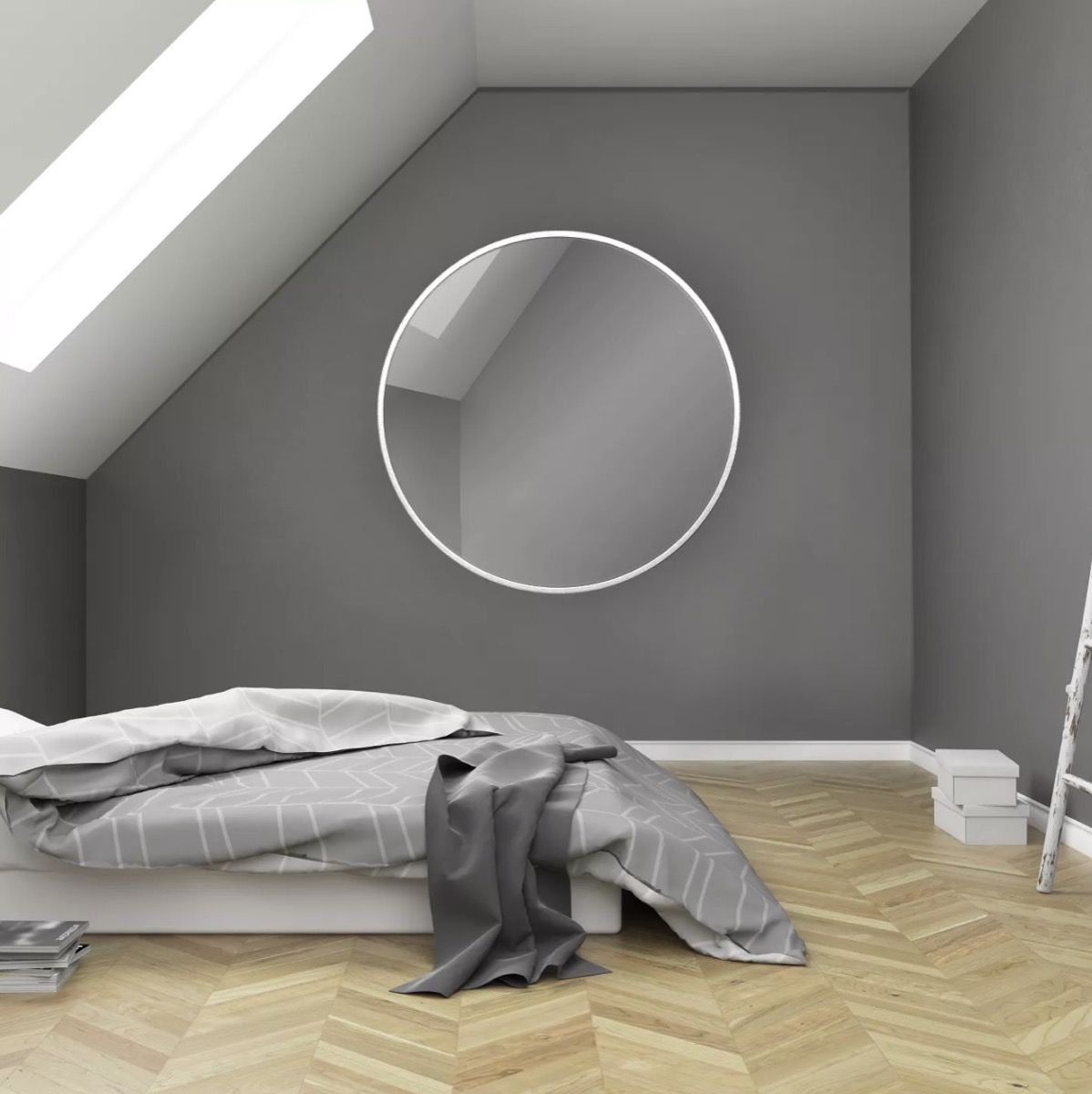 gray room with bed on the floor and round mirror, target home decor items