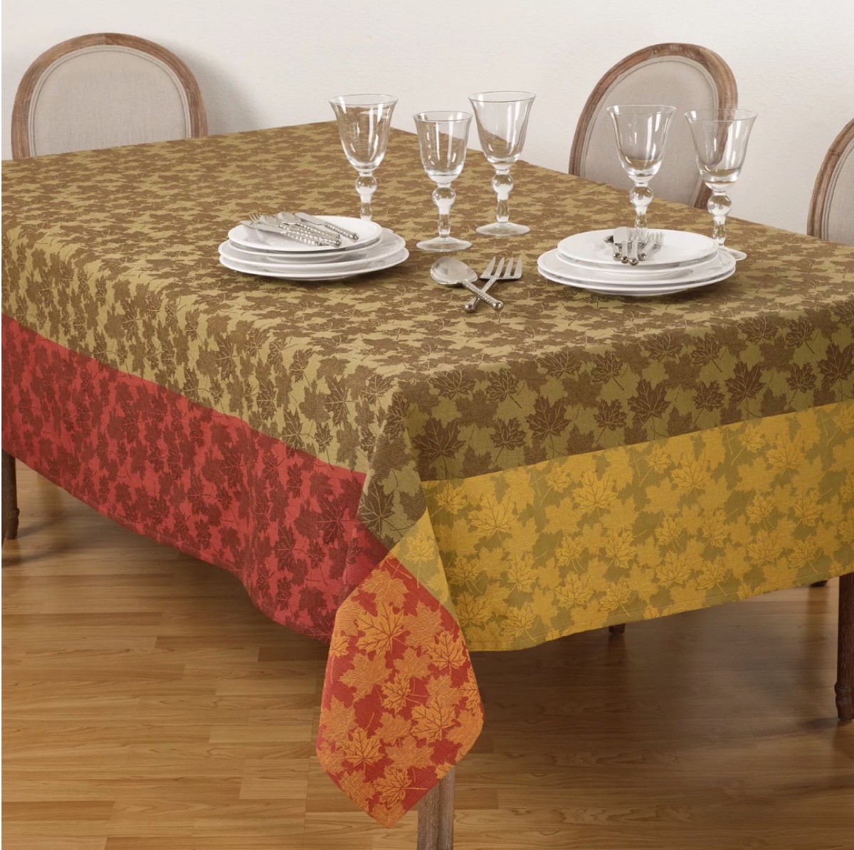 multicolored tablecloth with leaf print, fall decorating tips
