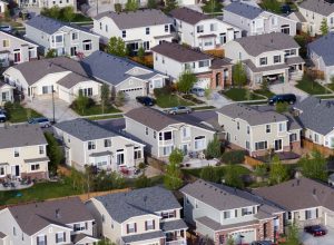 a view of a traditional cookie cutter american suburb from like helicopter height