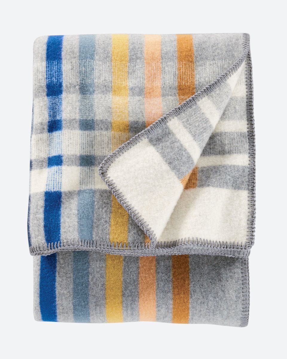 gray, blue, orange, and yellow pendleton blanket