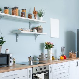 stylish kitchen with butcher block counters and stainless steel appliances, kitchen accessories