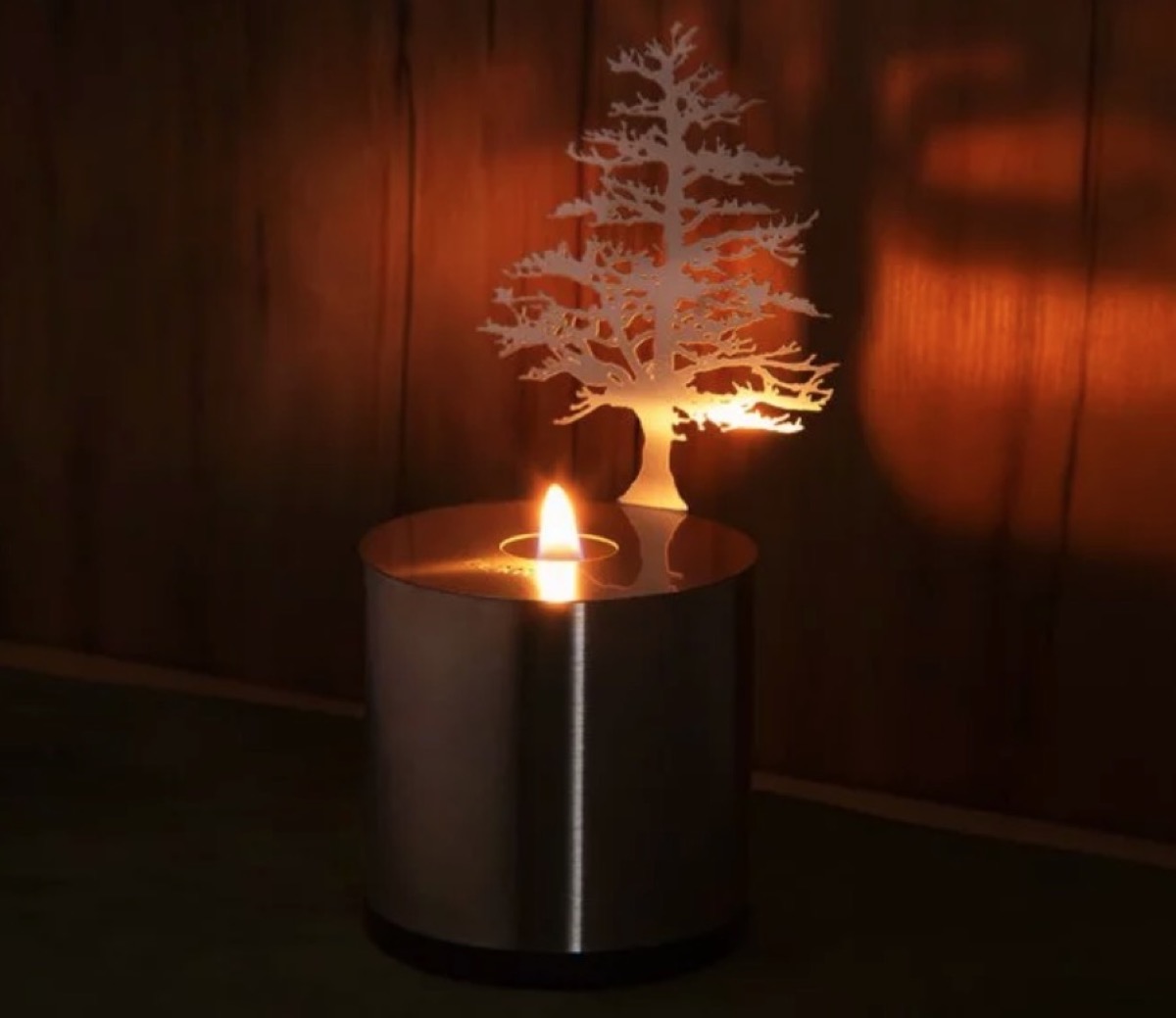 tea light in metal can with cutout tree, fall decorating tips