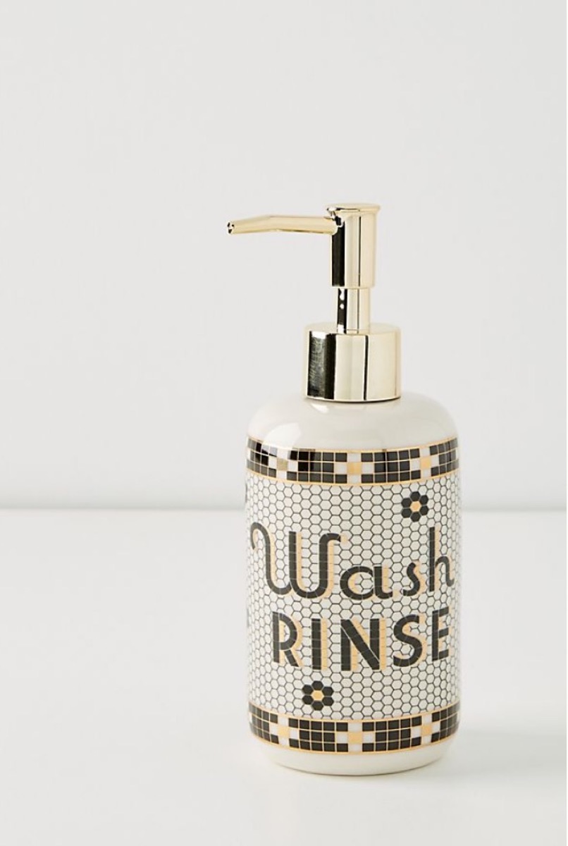 soap dispenser with wash and rinse written on it, bathroom accessories