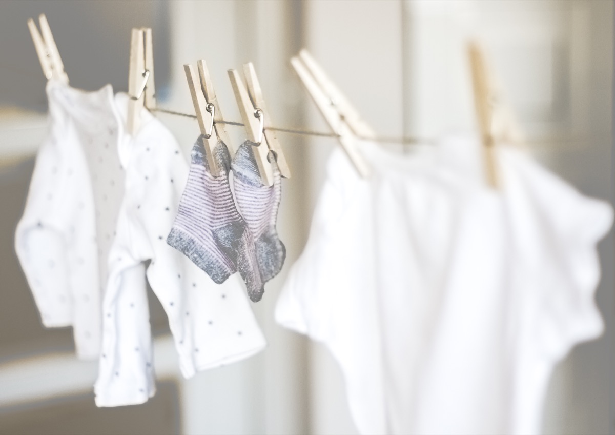 Baby clothes hanging on rope