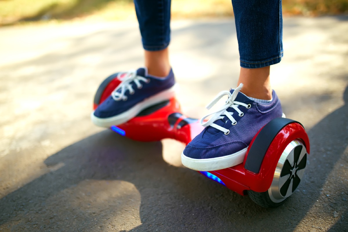 woman riding hoverboard in canvas sneakers, fire prevention tips