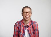 Woman in glasses laughing