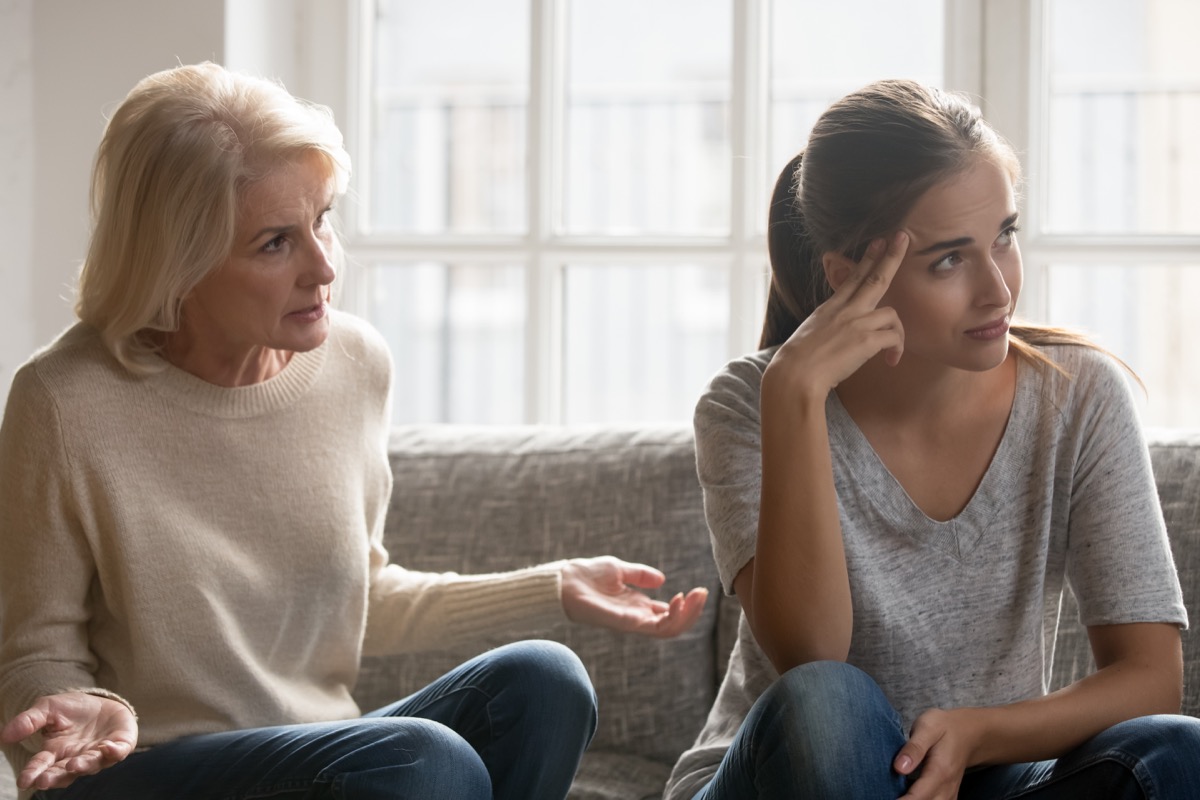 Older woman frustrated during conversation with younger woman