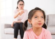 asian girl annoyed at scolding mom