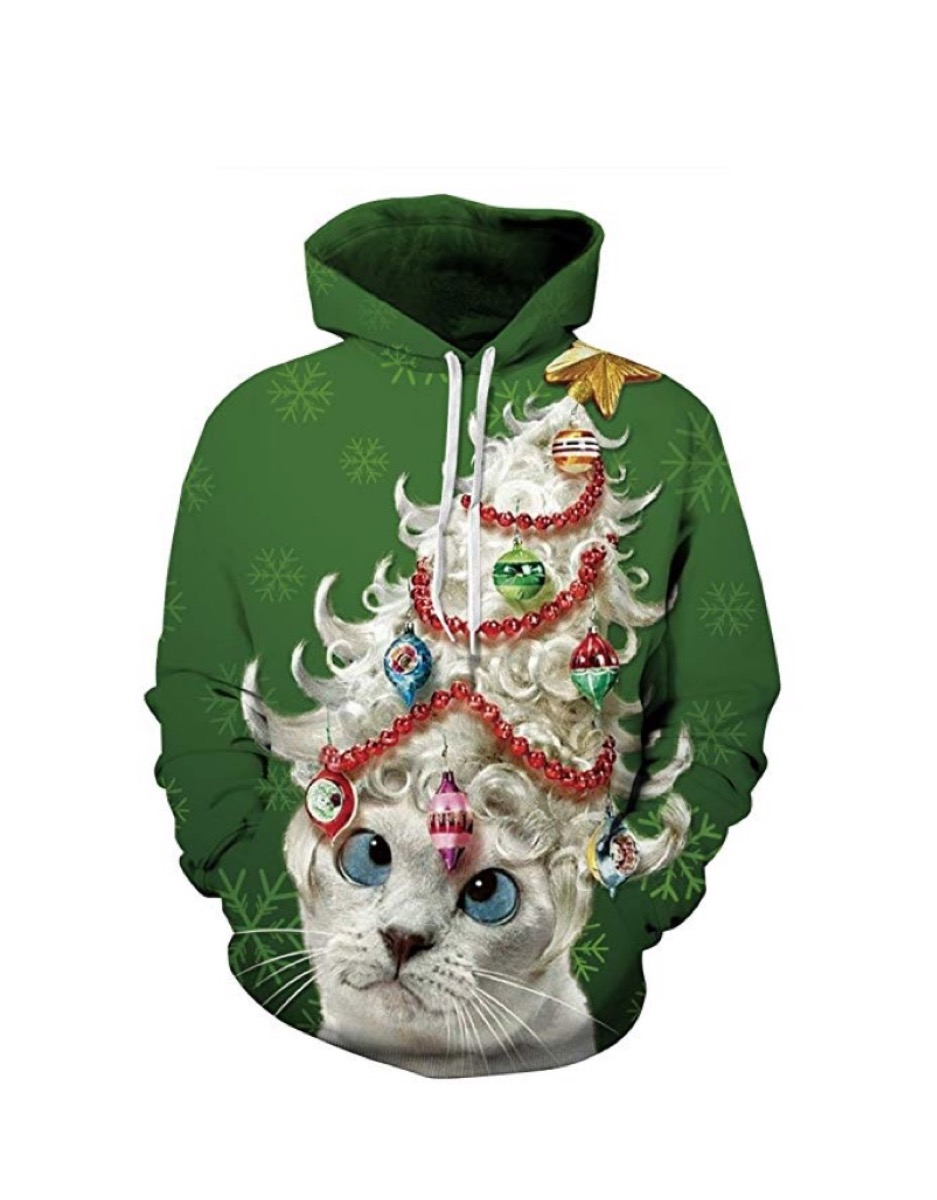 green sweatshirt with gray cat with christmas tree on its head