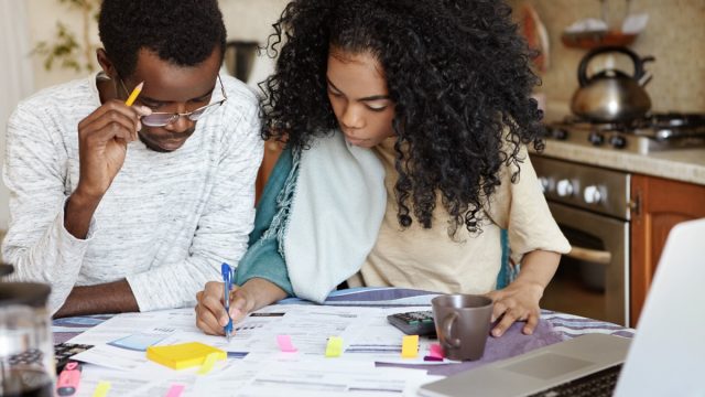 couple looking over a financial budget for home renovations
