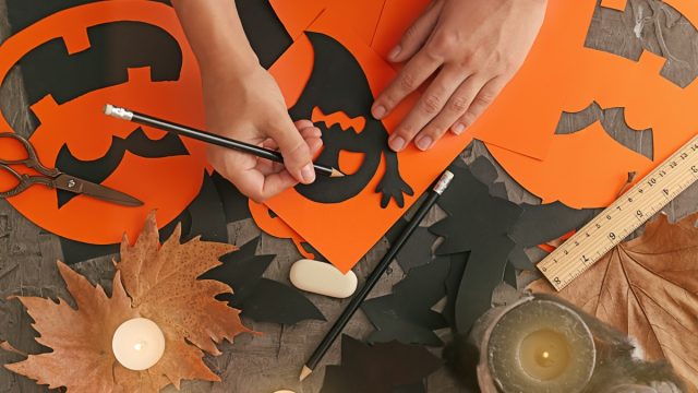 Person making DIY crafts for Halloween