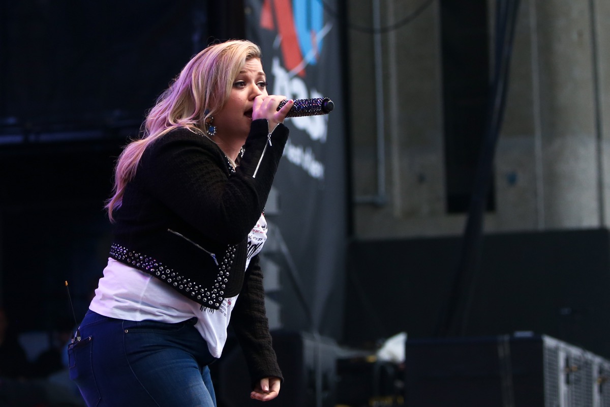 Kelly Clarkson performing at a concert reality show musicians