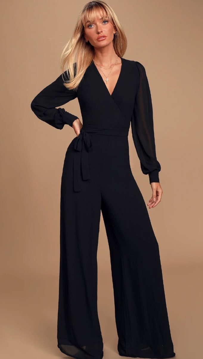 blonde woman in black long sleeved jumpsuit