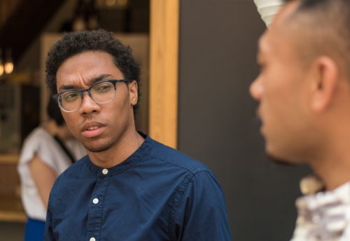 Man looking annoyed during a conversation 