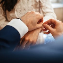 man clasping bracelet on woman's wrist, etsy jewelry