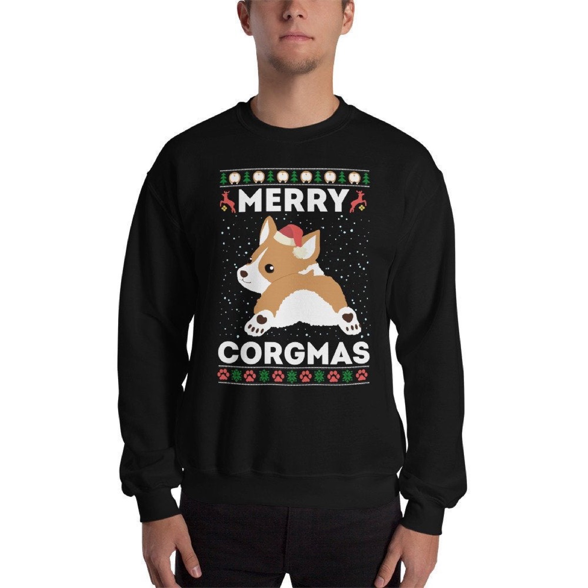 white man wearing black sweater with "merry corgmas" on it