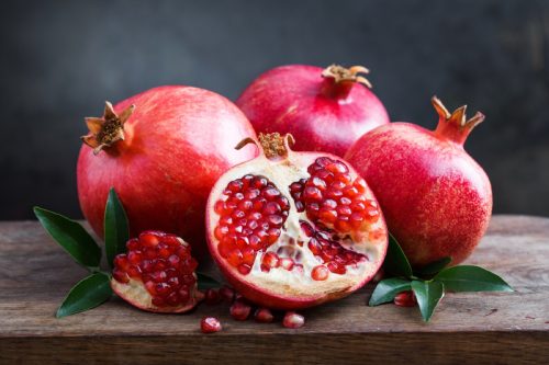 pomegranates on wooden table, rosh hashanah facts