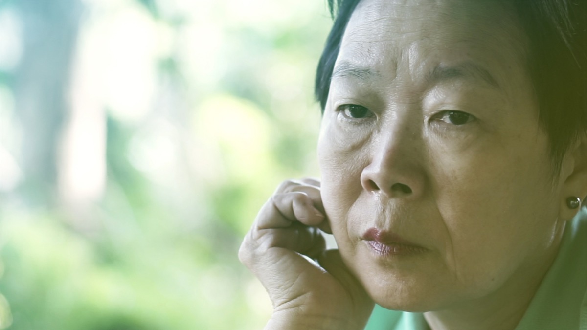 worried older asian woman