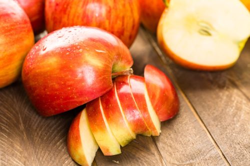 sliced apples on wooden table, rosh hashanah facts