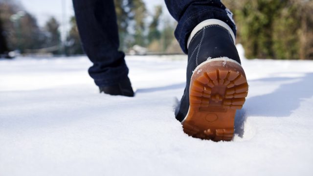 man walking in snow, men's winter boots