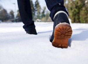 man walking in snow, men's winter boots