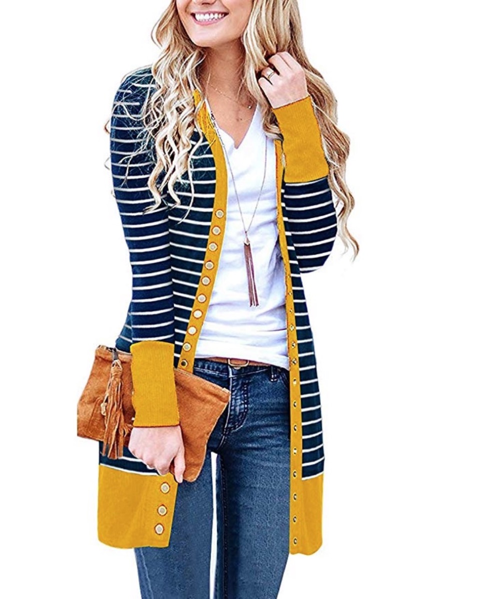 woman wearing black and white striped sweater with yellow trim