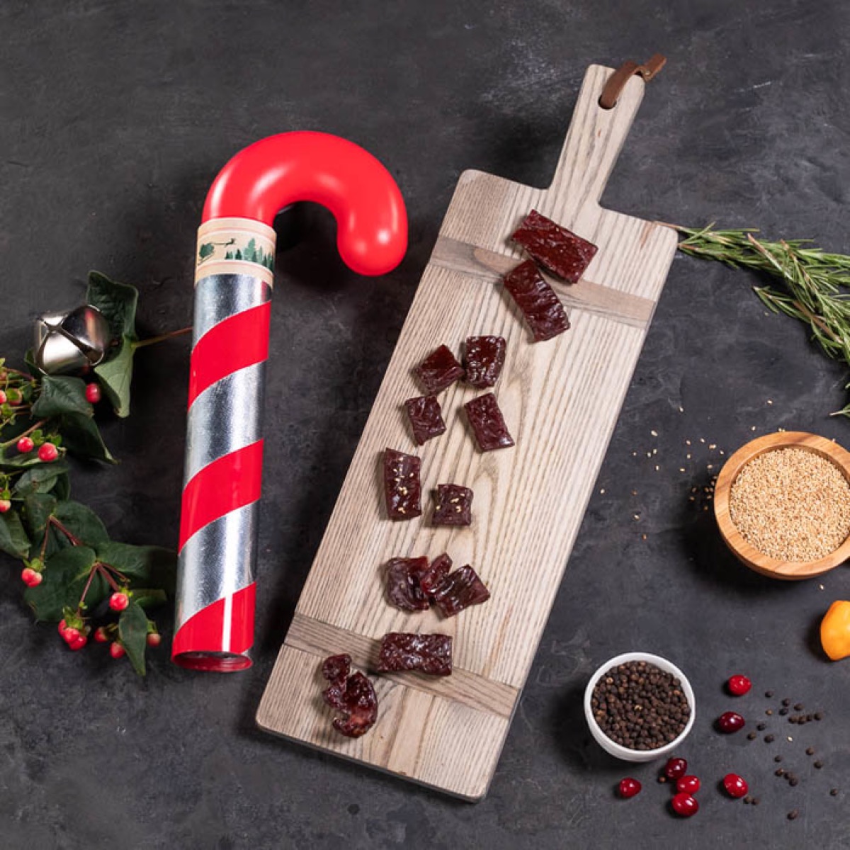jerky cane with samples on a cutting board