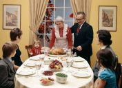 1970s THREE GENERATION FAMILY HAVING THANKSGIVING DINNER