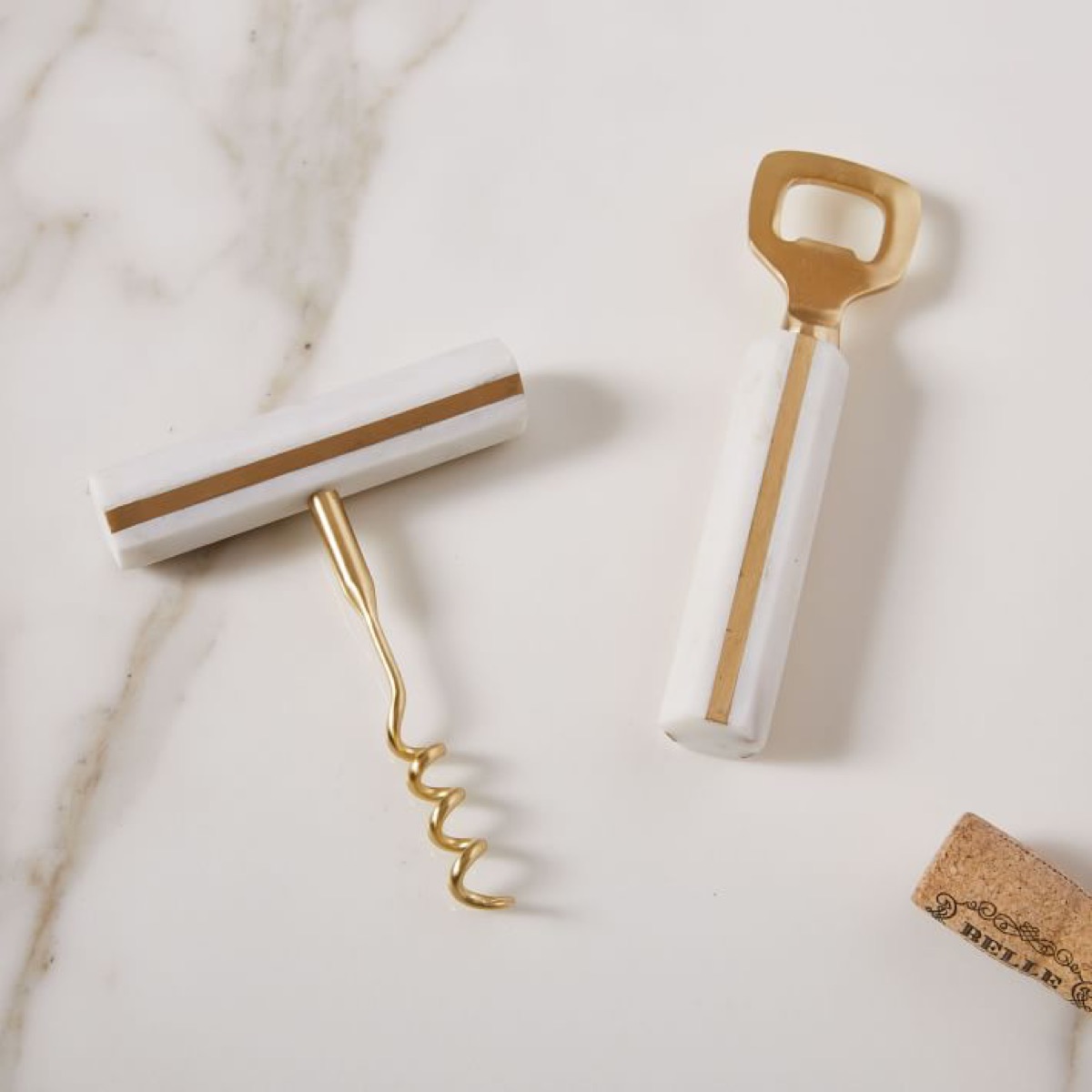 gold corksrew and bottle opener with marble trim