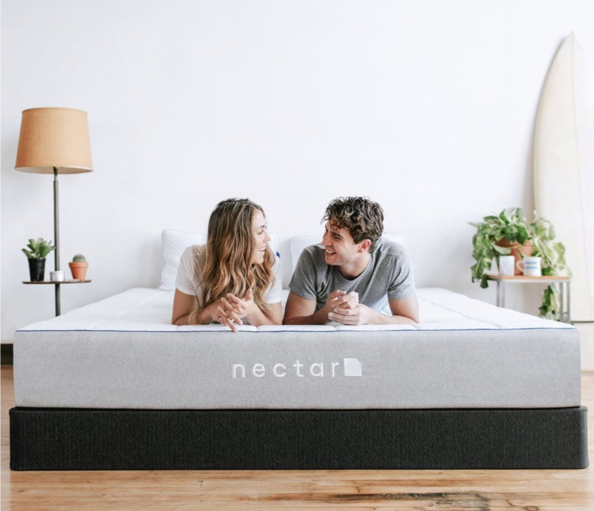 Couple talking on new mattress