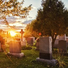 a cemetery during sunrise