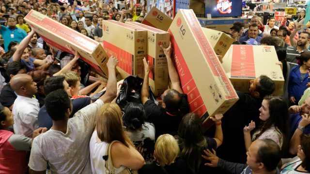 Shoppers rush to buy televisions during a chaotic Black Friday sale