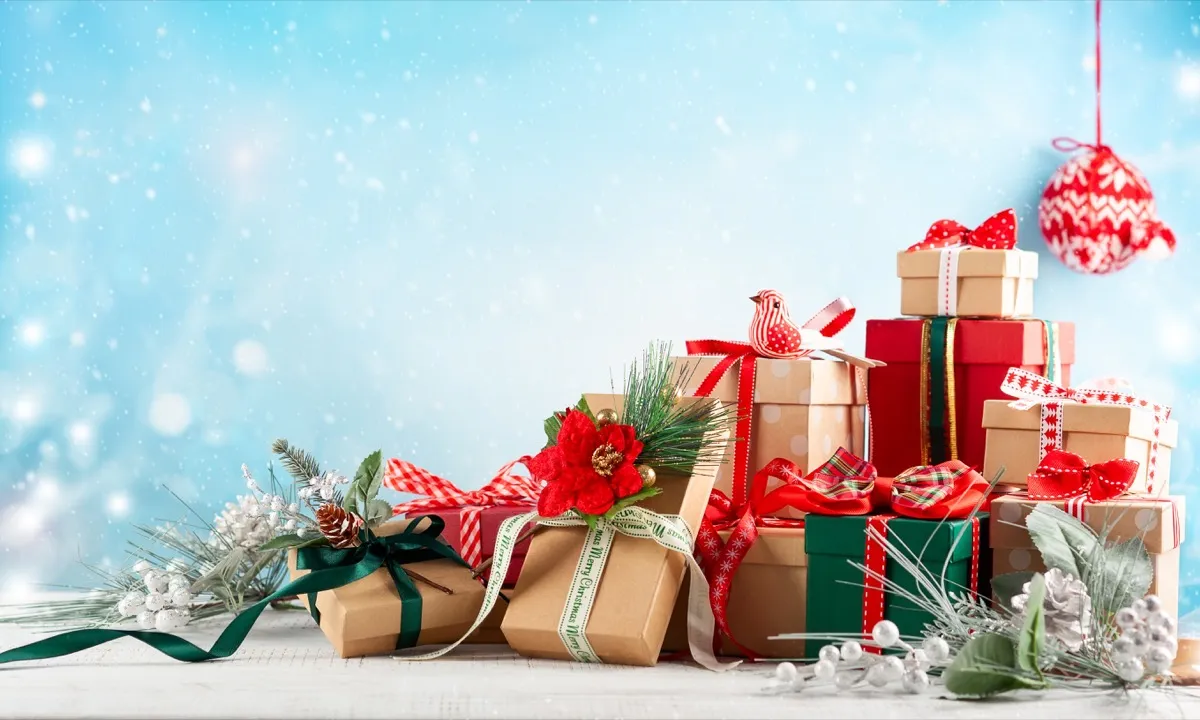 https://bestlifeonline.com/wp-content/uploads/sites/3/2019/11/christmas-background-with-festive-gift-boxes.jpg?quality=82&strip=all