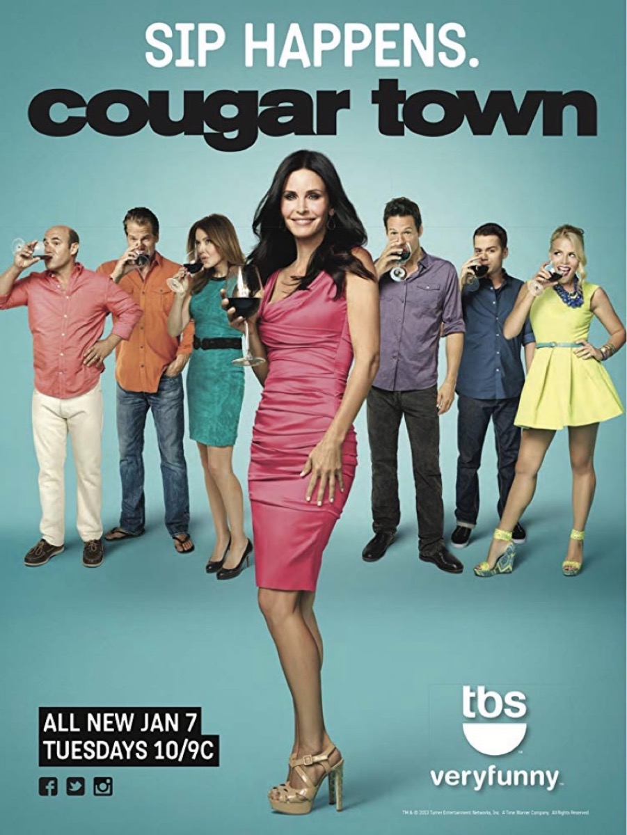 courteney cox and cast of middle-aged white people on green background in cougar town promo image