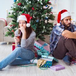 couple arguing and looking upset on Christmas