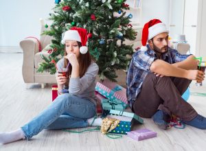 couple arguing and looking upset on Christmas