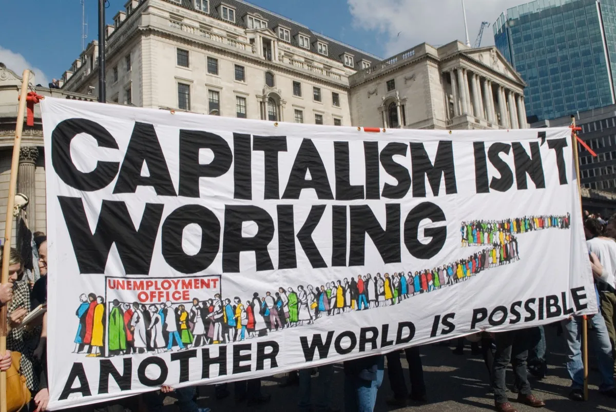 G20 protest outside Bank of England includes sign that reads "Capitalism Isn't Working, Another World is Possible"