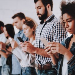 young people in a line on the phone