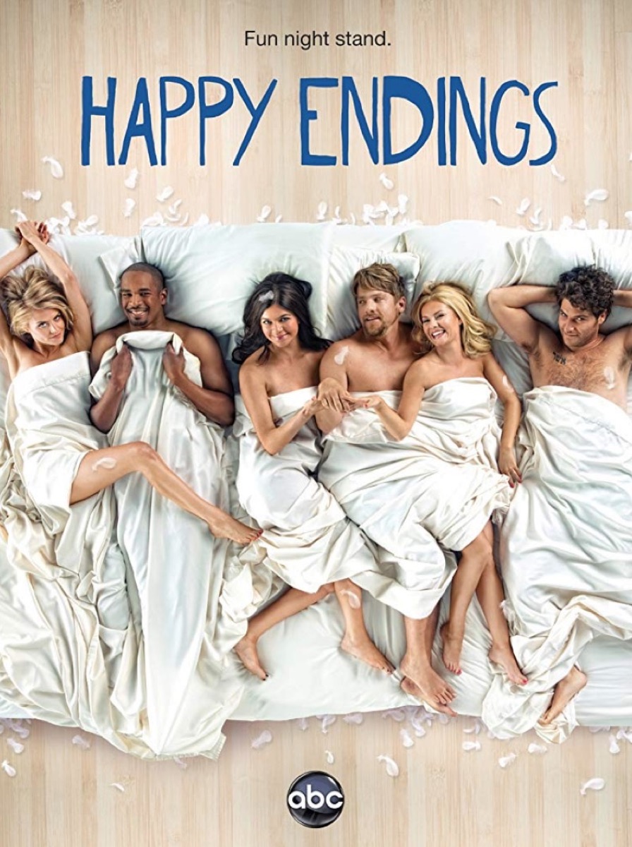 six 20-somethings in bed together wearing white sheets in happy endings promo image