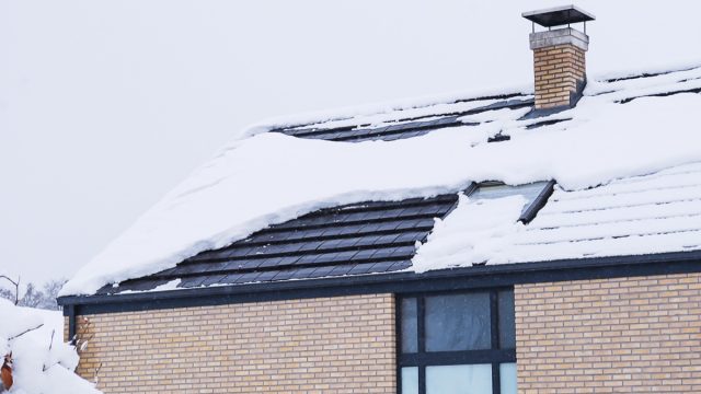 home covered in snow on the roof