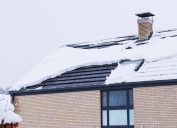 home covered in snow on the roof
