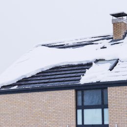home covered in snow on the roof