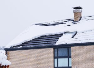 home covered in snow on the roof