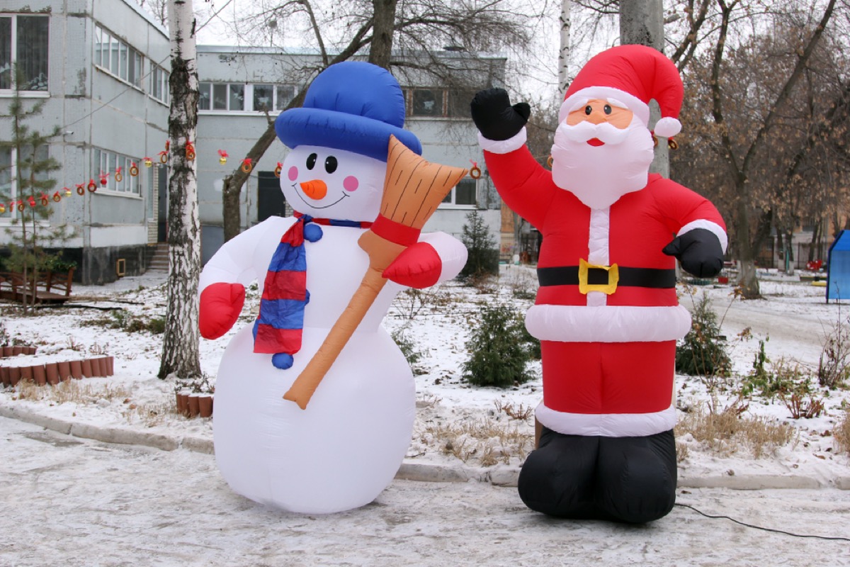 inflatable santa and snowman outside
