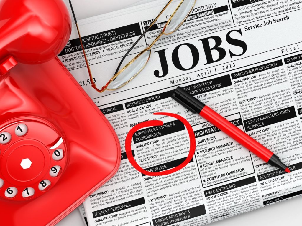 job listings in newspaper and red phone