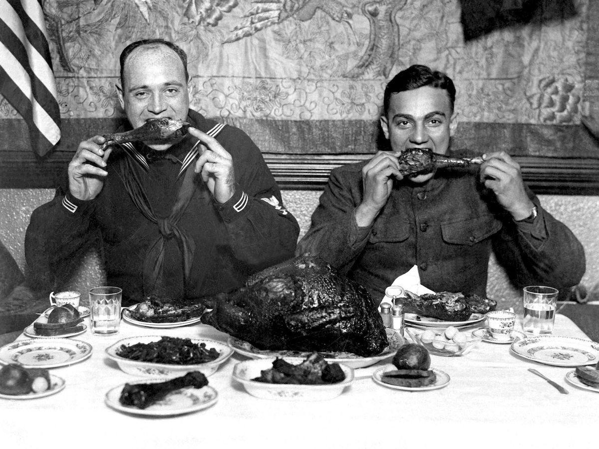 WWI service men enjoy a publically hosted Thanksgiving dinner in New York City. 1918.